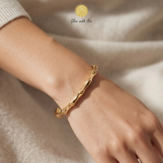 Detail shot showcasing the tarnish-free gold bracelet design with a subtle diamond accent.