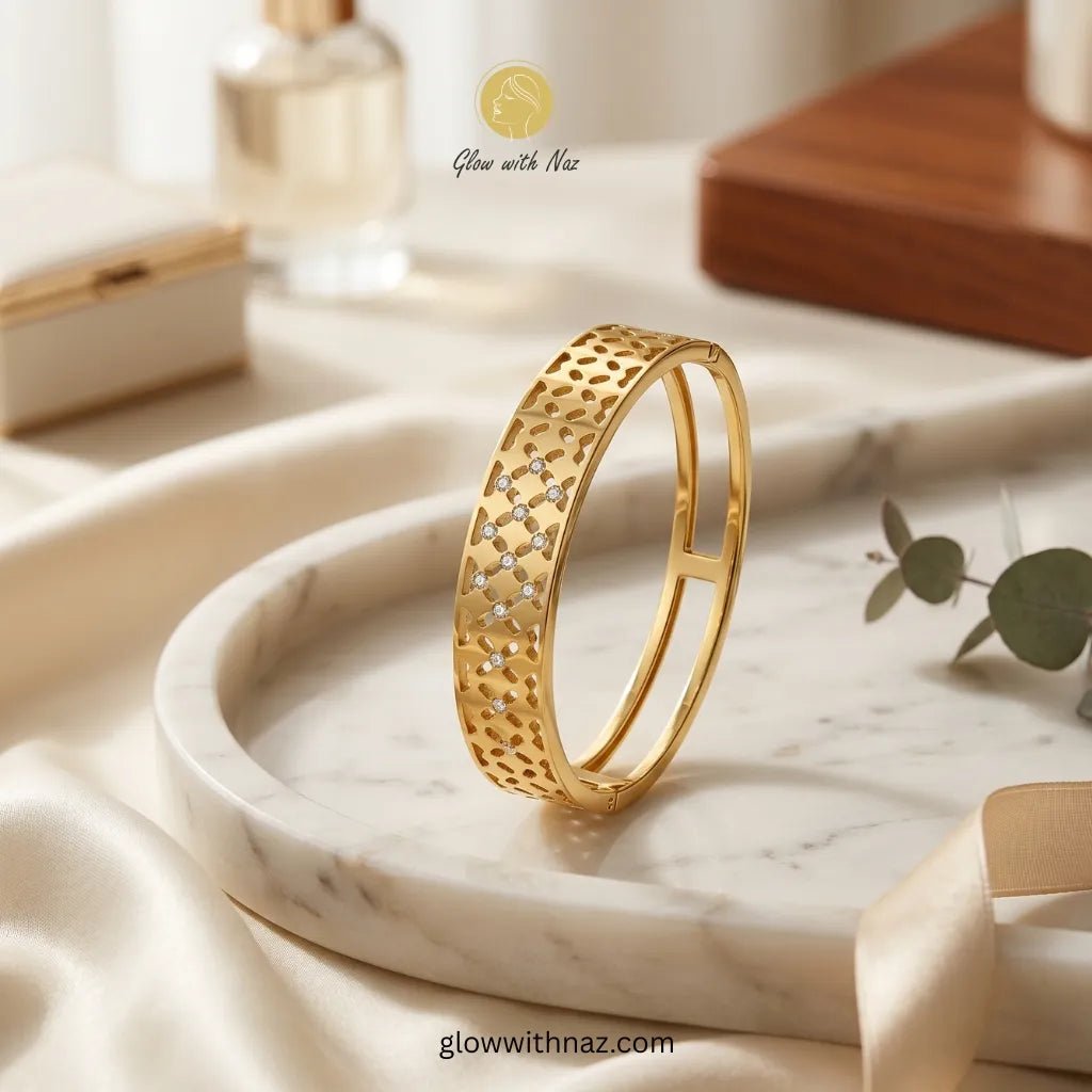 Gold Filigree Cutwork Zircon Bangle Bracelet - Gold Filigree Cutwork Zircon Bangle BraceletJewelryGlow With NazGlow With NazN-B034N-B034Gold filigree cutwork bangle with sparkling zircon stones on marble tray โ anti - tarnish stainless steel bangle online in Pakistan by Glow with Naz