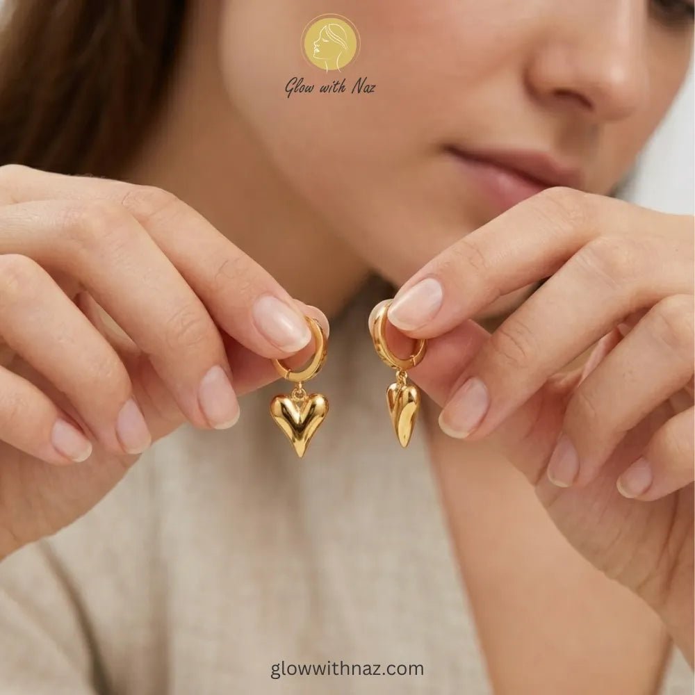 Tiktok Viral Heart Hoop Earrings in Pakistan | Stainless Steel Hoop Earrings - Tiktok Viral Heart Hoop Earrings in Pakistan | Stainless Steel Hoop EarringsJewelryGlow With NazGlow With NazE0010E0010Pair of elegant gold-tone hoop earrings with a dangling puffed heart charm