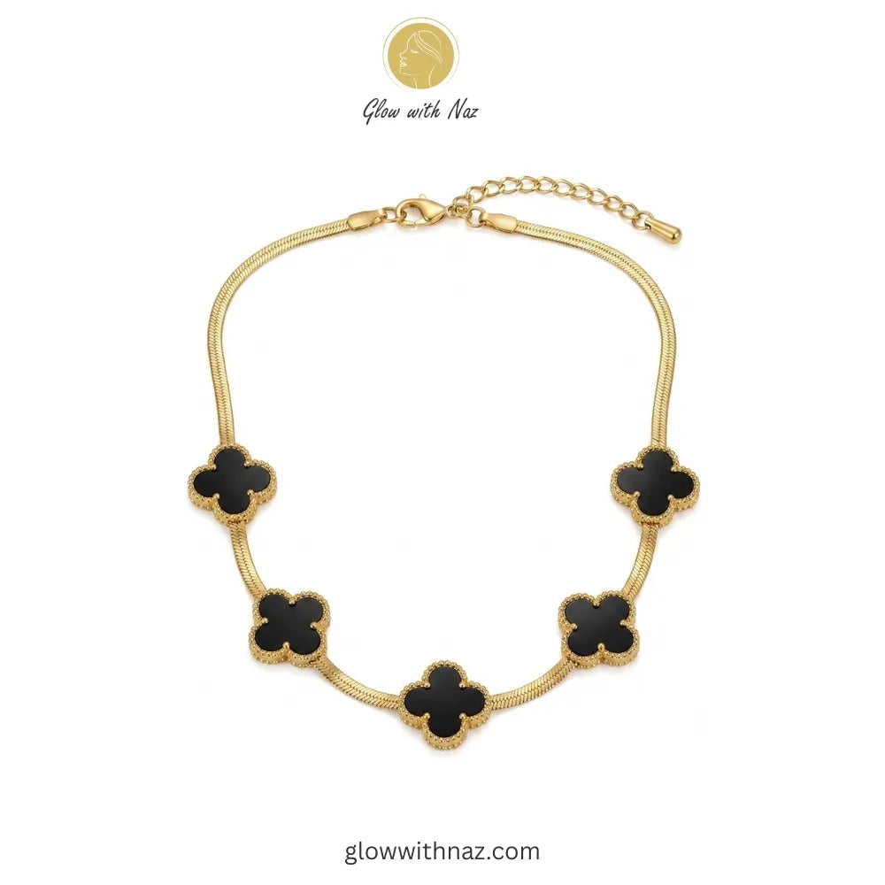 18K Gold Snake Chain Necklace Five-Motif Black Enamel Pink tulip Necklace with pink stones on a white plate, brand 'Glow with Naz' visible
