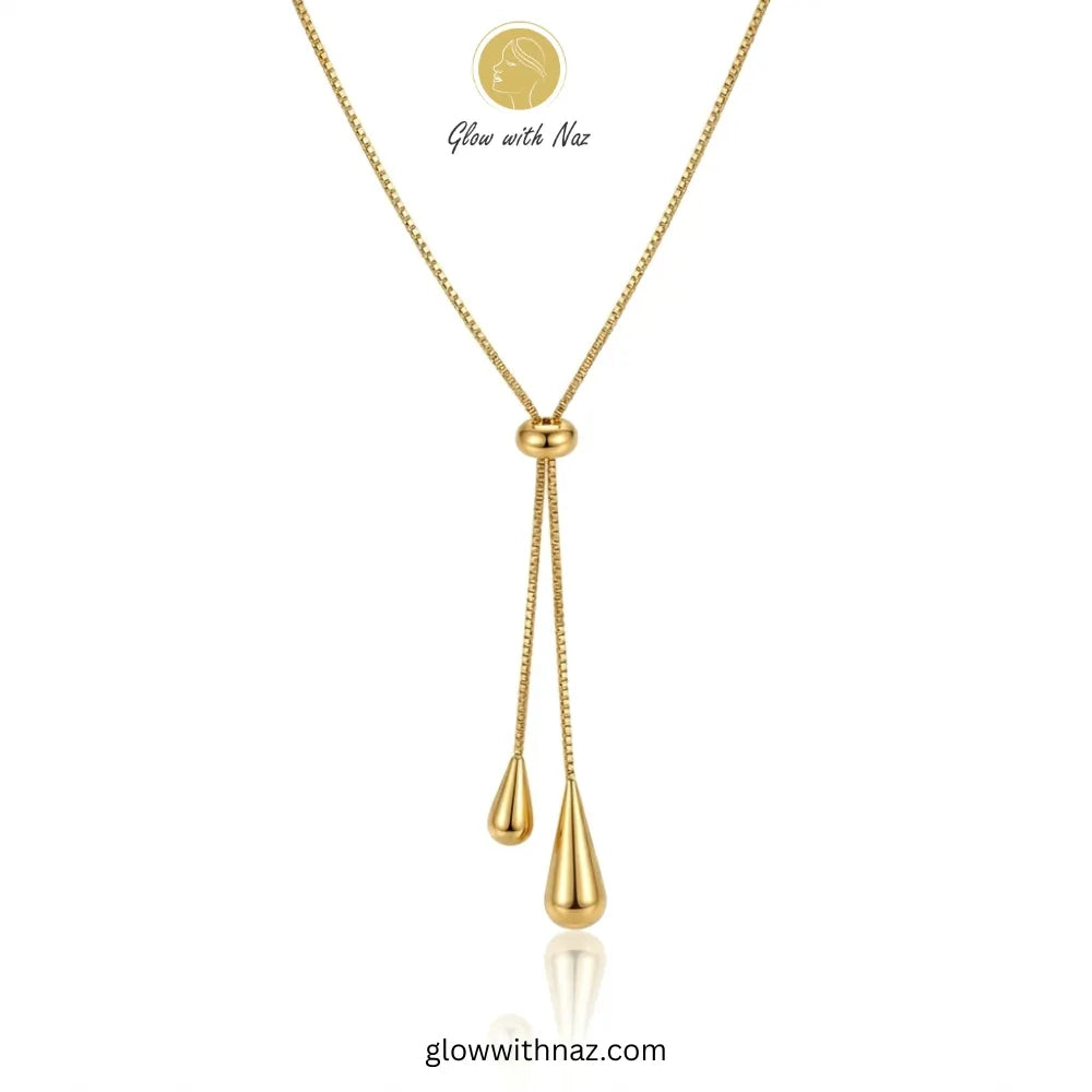 Adjustable gold lariat necklace with teardrop charms by Glow with Naz necklace, pendant necklace, necklace set, locket set, simple necklace, pendant set, pendant, chain necklace, diamond pendant, diamond necklace, locket necklace, neck chain, girls locket, heart locket, pendant for girls, necklace for girls, heart necklace, locket for girls, diamond locket, pendant necklace for girls, heart chain locket, stainless steel necklace, double chain necklace, ruby necklace, neck chain for girls, locket design, pen