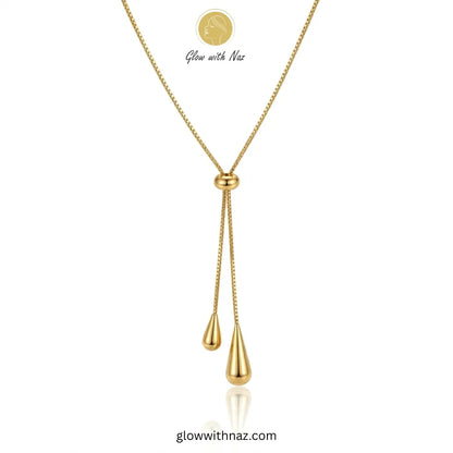 Adjustable gold lariat necklace with teardrop charms by Glow with Naz necklace, pendant necklace, necklace set, locket set, simple necklace, pendant set, pendant, chain necklace, diamond pendant, diamond necklace, locket necklace, neck chain, girls locket, heart locket, pendant for girls, necklace for girls, heart necklace, locket for girls, diamond locket, pendant necklace for girls, heart chain locket, stainless steel necklace, double chain necklace, ruby necklace, neck chain for girls, locket design, pen