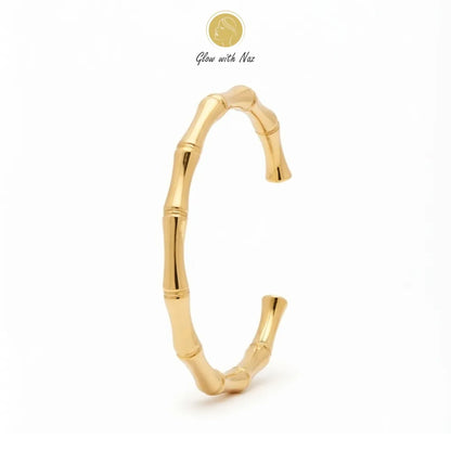 Close-up of a woman wearing the Glow With Naz elegant stainless steel bone cuff golden bracelet.