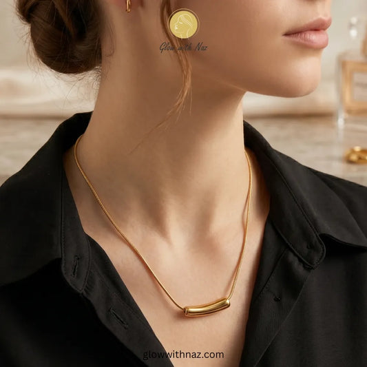 Close-up of smooth gold tube bar pendant texture necklace, pendant necklace, necklace set, locket set, simple necklace, pendant set, pendant, chain necklace, diamond pendant, diamond necklace, locket necklace, neck chain, girls locket, heart locket, pendant for girls, necklace for girls, heart necklace, locket for girls, diamond locket, pendant necklace for girls, heart chain locket, stainless steel necklace, double chain necklace, ruby necklace, neck chain for girls, locket design, pendant design, necklace