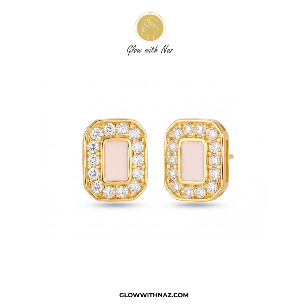 A pair of gold-toned rectangular stud earrings with a pale pink center and clear pavé-set stones, shown on a white background with the brand name Glow with Naz above and GlowWithNaz.com below. studs earrings, small earrings, girls earrings, simple earrings, earrings for girls, black earrings, earrings, ear rings, earrings tops, stud earrings, tops earrings, aesthetic earrings, hoop earrings, drop earrings, diamond earrings, pink earrings, green earrings, ear ring, earrings for women, flower earrings, golden