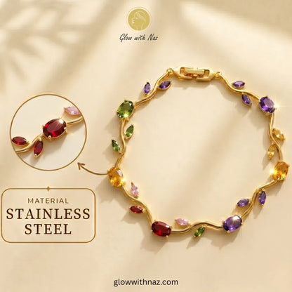 A gold-tone stainless steel bracelet with colorful gemstone accents, displayed on a warm beige background with promotional text and a circular detail inset. Tulip Rapunzel bracelet, floral tulip bracelet, Rapunzel inspired jewelry, aesthetic tulip bracelet, trendy charm bracelet, stainless steel tulip bracelet, gold plated flower bracelet, delicate floral wrist accessory, cute aesthetic jewelry, viral tulip bracelet, Rapunzel theme accessories, dainty floral bracelet, crystal tulip charm, stacking bracelets