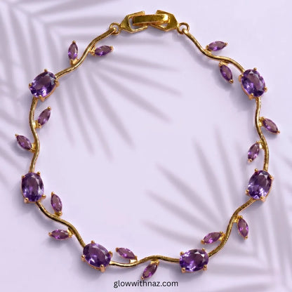 Gold bracelet with purple gemstones on a light purple background Tulip Rapunzel bracelet, floral tulip bracelet, Rapunzel inspired jewelry, aesthetic tulip bracelet, trendy charm bracelet, stainless steel tulip bracelet, gold plated flower bracelet, delicate floral wrist accessory, cute aesthetic jewelry, viral tulip bracelet, Rapunzel theme accessories, dainty floral bracelet, crystal tulip charm, stacking bracelets for women, minimalist floral jewelry, spring aesthetic bracelet, elegant tulip wristband, a