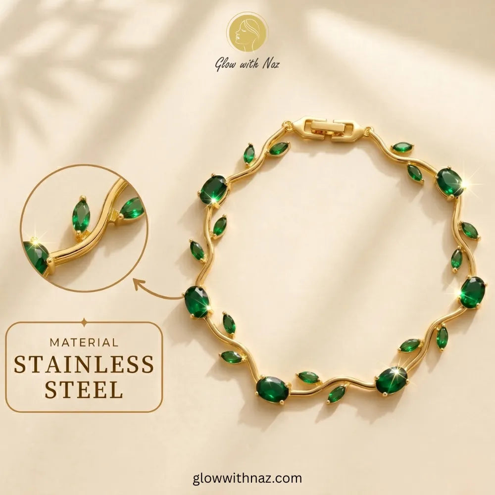 Gold bracelet with green gemstones on a beige background, featuring the brand 'Glow with Naz'. Tulip Rapunzel bracelet, floral tulip bracelet, Rapunzel inspired jewelry, aesthetic tulip bracelet, trendy charm bracelet, stainless steel tulip bracelet, gold plated flower bracelet, delicate floral wrist accessory, cute aesthetic jewelry, viral tulip bracelet, Rapunzel theme accessories, dainty floral bracelet, crystal tulip charm, stacking bracelets for women, minimalist floral jewelry, spring aesthetic bracel
