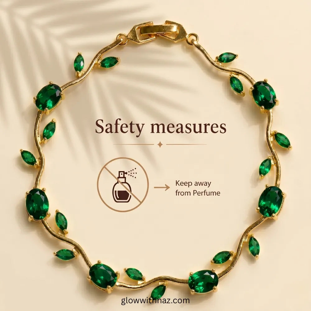 Gold vine-style bracelet with green marquise and oval stones, shown on a beige background with text reading 'Safety measures' and a perfume icon warning it should be kept away from perfume. Tulip Rapunzel bracelet, floral tulip bracelet, Rapunzel inspired jewelry, aesthetic tulip bracelet, trendy charm bracelet, stainless steel tulip bracelet, gold plated flower bracelet, delicate floral wrist accessory, cute aesthetic jewelry, viral tulip bracelet, Rapunzel theme accessories, dainty floral bracelet, crysta