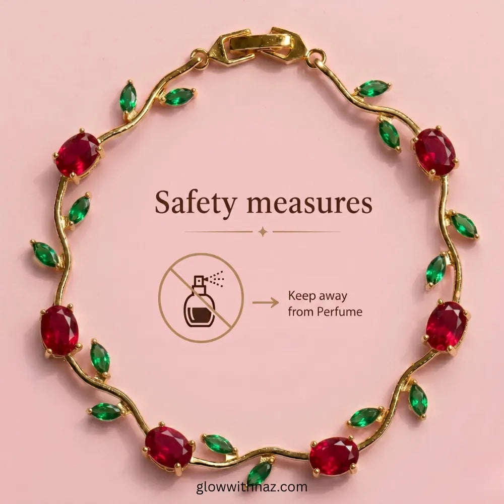 Gold vine bracelet with oval red gemstones and green marquise leaves, arranged in a circle on a pink background with text reading 'Safety measures' and a perfume warning icon. Tulip Rapunzel bracelet, floral tulip bracelet, Rapunzel inspired jewelry, aesthetic tulip bracelet, trendy charm bracelet, stainless steel tulip bracelet, gold plated flower bracelet, delicate floral wrist accessory, cute aesthetic jewelry, viral tulip bracelet, Rapunzel theme accessories, dainty floral bracelet, crystal tulip charm,