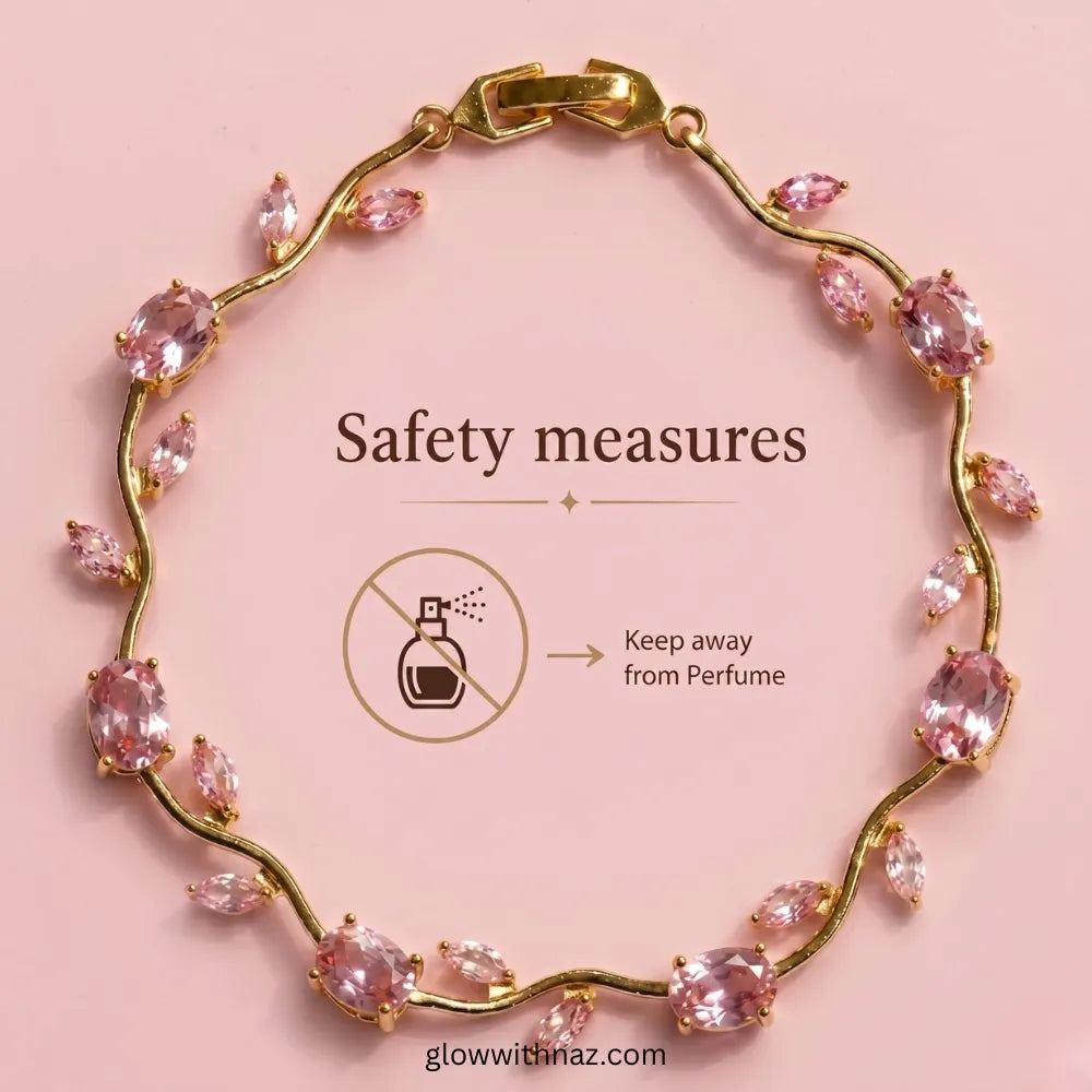 Gold chain bracelet with marquise-cut pink crystals, arranged in a circle on a pink background with safety text and an icon indicating it should be kept away from perfume. Tulip Rapunzel bracelet, floral tulip bracelet, Rapunzel inspired jewelry, aesthetic tulip bracelet, trendy charm bracelet, stainless steel tulip bracelet, gold plated flower bracelet, delicate floral wrist accessory, cute aesthetic jewelry, viral tulip bracelet, Rapunzel theme accessories, dainty floral bracelet, crystal tulip charm, sta