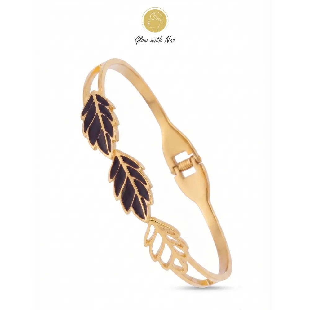 Close-up of the elegant stainless steel 3 leave hand cuff golden bracelet by Glow With Naz.