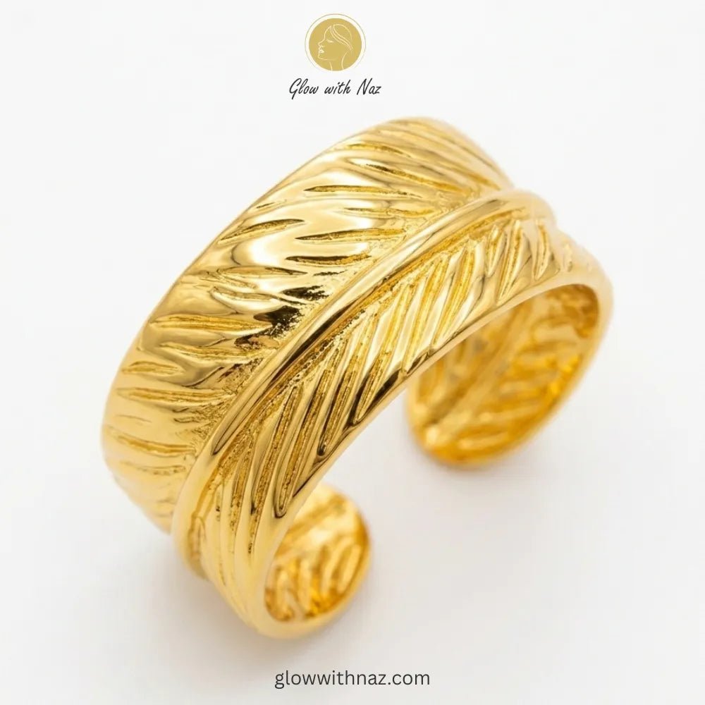 Adjustable Gold-Plated Stainless Steel Feather Wrap Wide Cuff Ring for Girls - Adjustable Gold-Plated Stainless Steel Feather Wrap Wide Cuff Ring for GirlsJewelryGlow With NazGlow With NazR0013R0013A gold-plated wide cuff ring featuring an intricate feather wrap design, adjustable for a perfect fit. ring, girls rings, rings for girls, rings simple, simple rings, stainless steel jewelry, jewellery set, aesthetic jewelry, simple jewellery, chain, jewelry, artificial jewellery, green jewellery, gir