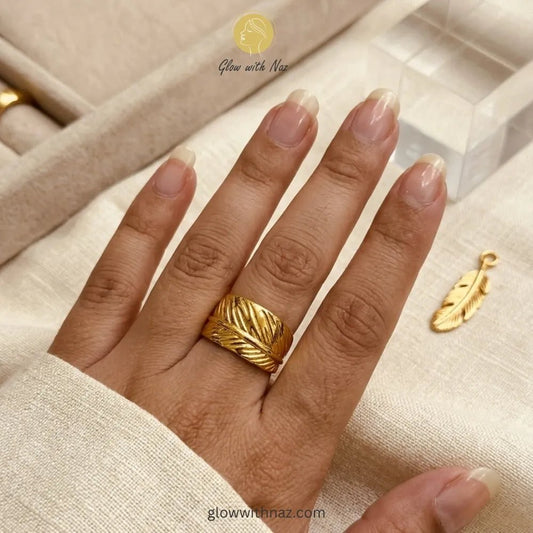 Adjustable Gold-Plated Stainless Steel Feather Wrap Wide Cuff Ring for Girls - Adjustable Gold-Plated Stainless Steel Feather Wrap Wide Cuff Ring for GirlsJewelryGlow With NazGlow With NazR0013R0013A stylish, free-size gold ring with a detailed feather wrap pattern, crafted from premium stainless steel. ring, girls rings, rings for girls, rings simple, simple rings, stainless steel jewelry, jewellery set, aesthetic jewelry, simple jewellery, chain, jewelry, artificial jewellery, green jewellery,