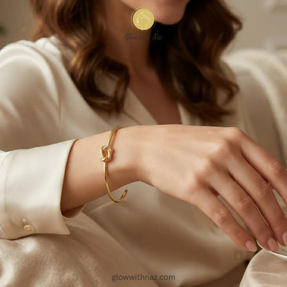 Bundle Offer: Anti-Tarnish Knot Stud Earrings & Knot Hand Cuff Bracelet - Bundle Offer: Anti-Tarnish Knot Stud Earrings & Knot Hand Cuff BraceletJewelryGlow With NazGlow With NazClose-up view of polished gold knot detail on cuff bracelet