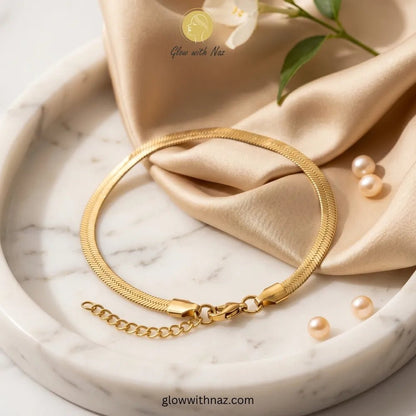 Elegant Gold-Plated Simple Stainless Steel Snake Chain Bracelet - Elegant Gold-Plated Simple Stainless Steel Snake Chain BraceletJewelryGlow With NazGlow With NazB0039B0039Elegant gold-plated herringbone chain bracelet on model wrist by Glow with Naz