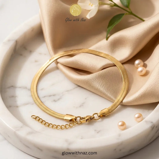 Elegant Gold-Plated Simple Stainless Steel Snake Chain Bracelet - Elegant Gold-Plated Simple Stainless Steel Snake Chain BraceletJewelryGlow With NazGlow With NazB0039B0039Elegant gold-plated herringbone chain bracelet on model wrist by Glow with Naz