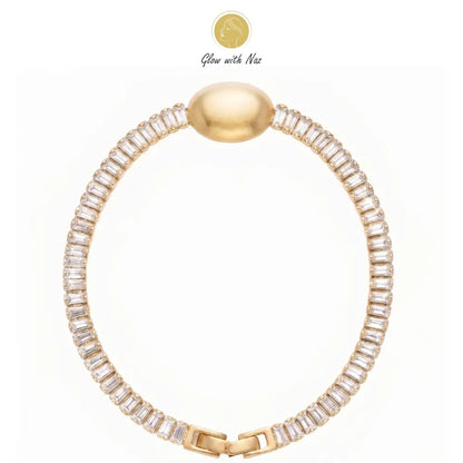Close-up of a woman's hand wearing the aesthetic crystal oval golden bracelet by Glow With Naz hand cuff bracelet, girls bracelet, bracelet for girls, simple bracelet, chain bracelet, bracelet chain, bracelet watch, hand bracelet, black jewellery, bracelet, ring bracelet, aesthetic bracelet, bracelet for women, bracelet set, cartier bracelet, cute bracelet, jewellery bracelet, bracelets, golden bracelet, clover bracelet, infinity bracelet, bangels, handcuffs bracelet, bracelet design, bracelet designs, brac