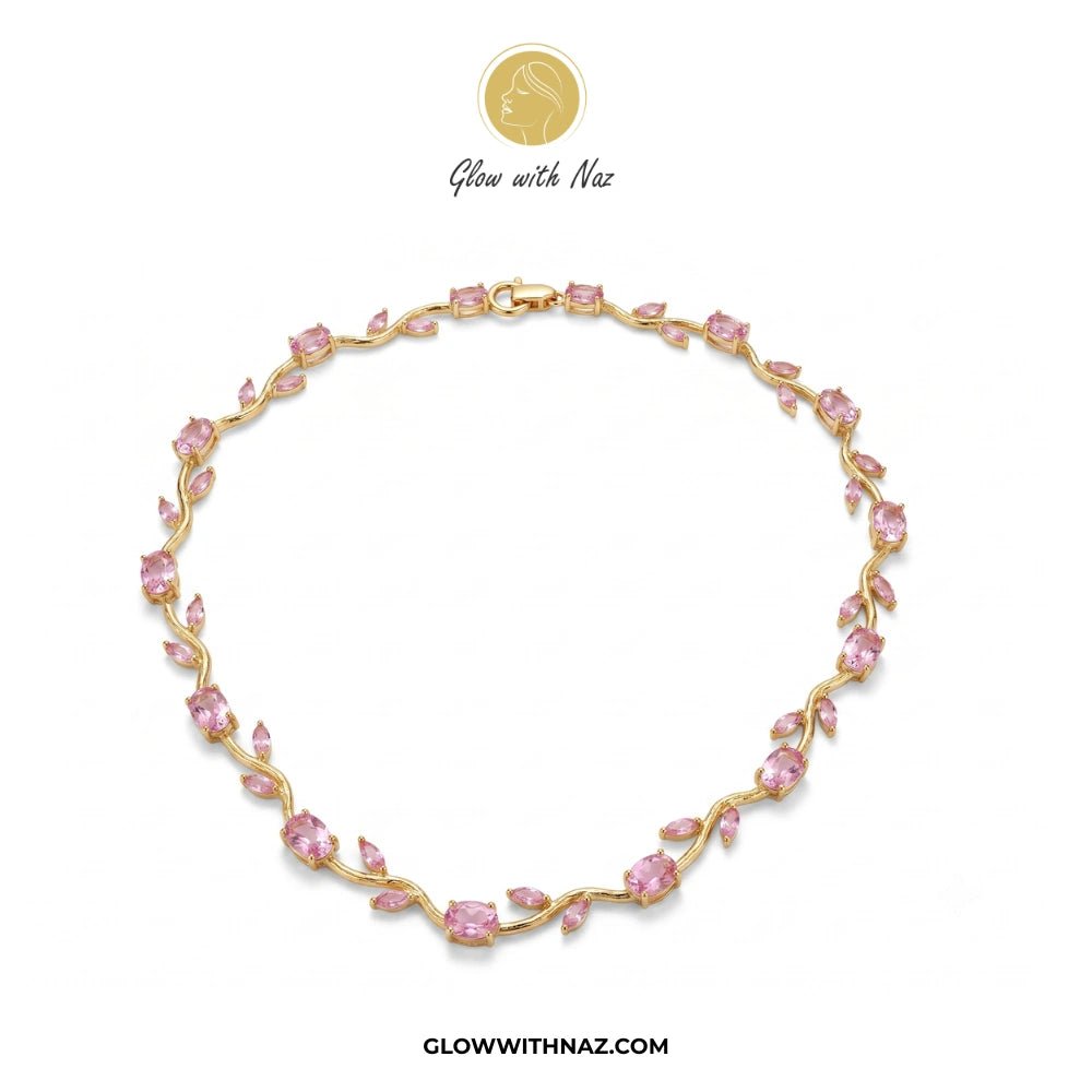 Gold Plated Stainless Steel Pink Tulip Necklace For Women - Gold Plated Stainless Steel Pink Tulip Necklace For WomenJewelryGlow With NazGlow With NazN0050N0050Tulip necklace Gold bracelet with pink stones on a white background, featuring the brand 'Glow with Naz'.