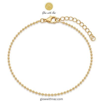 Gold Small Ball Bead Chain Anklet for Women - Gold Small Ball Bead Chain Anklet for WomenJewelryGlow With NazGlow With NazA001A001Gold ball chain anklet with lobster clasp and extension chain in 18K gold plated stainless steel, anti-tarnish payal online Pakistan by Glow with Naz
