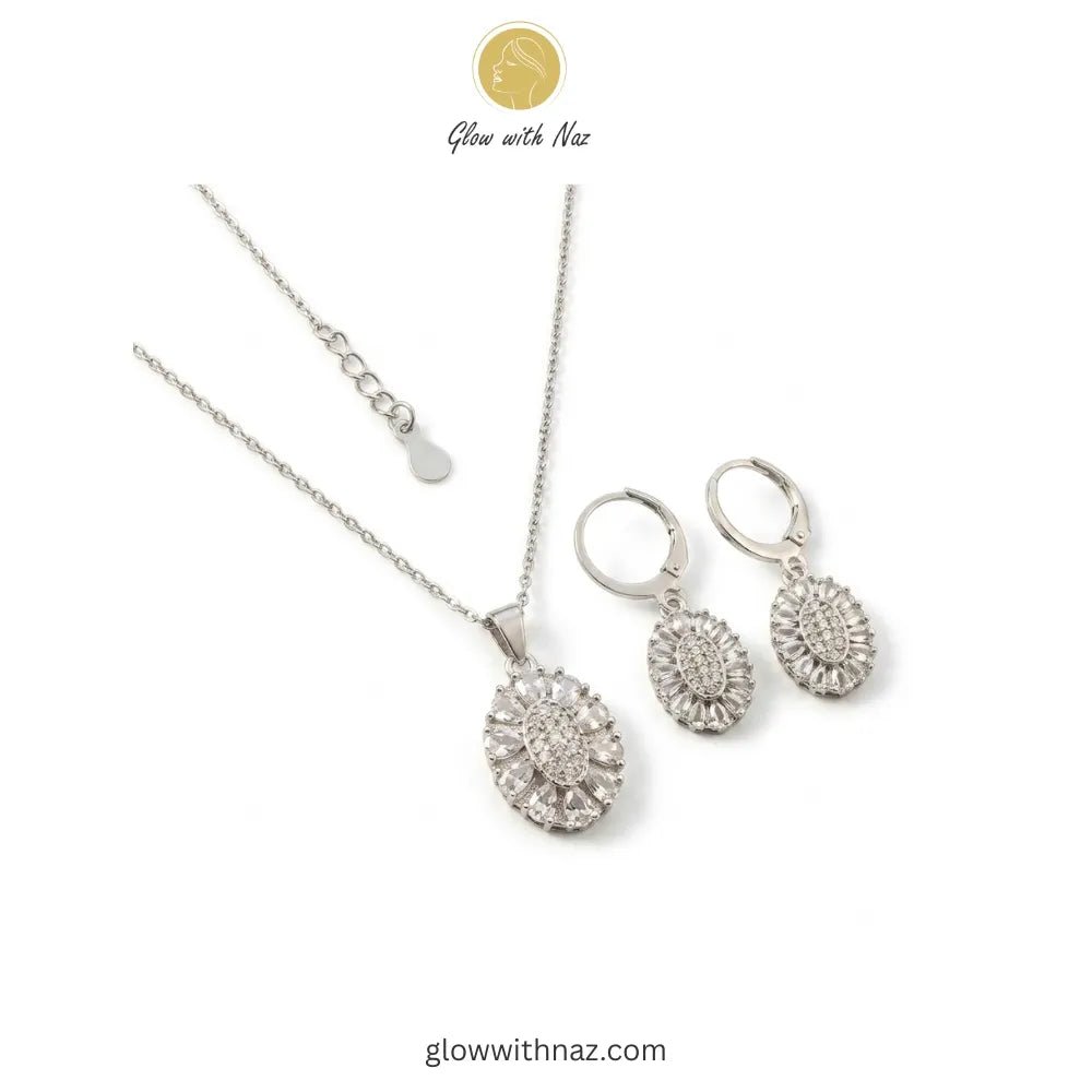 Silver Zircon Necklace Pendant & Hoop Earrings Set - Silver Zircon Necklace Pendant & Hoop Earrings SetJewelryGlow With NazGlow With NazN-N013N-N013Silver Zircon Necklace & Hoop Earrings Set Pink tulip Necklace with pink stones on a white plate, brand 'Glow with Naz' visible
