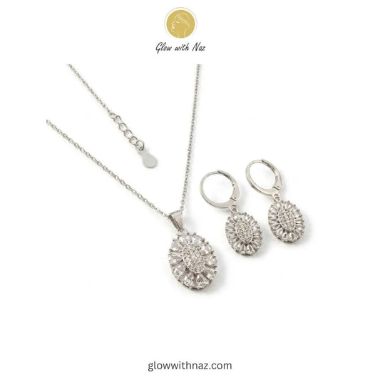 Silver Zircon Necklace Pendant & Hoop Earrings Set - Silver Zircon Necklace Pendant & Hoop Earrings SetJewelryGlow With NazGlow With NazN-N013N-N013Silver Zircon Necklace & Hoop Earrings Set Pink tulip Necklace with pink stones on a white plate, brand 'Glow with Naz' visible