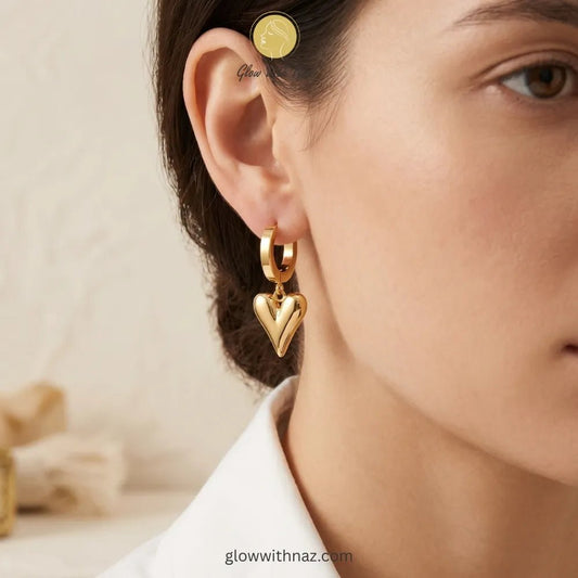 Tiktok Viral Heart Hoop Earrings in Pakistan | Stainless Steel Hoop Earrings - Tiktok Viral Heart Hoop Earrings in Pakistan | Stainless Steel Hoop EarringsJewelryGlow With NazGlow With NazE0010E0010Lifestyle shot of modern heart-shaped hoop earrings for everyday style